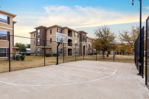 Basketball court and building exterior in background