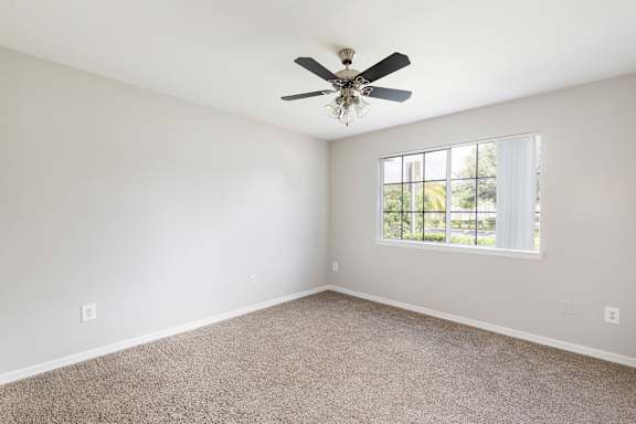 bedroom with carpeted flooring and a ceiling fan