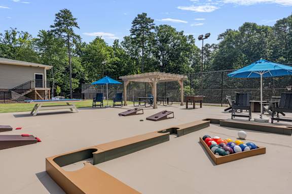 A playground with a slide, swings, and a ball pit.
