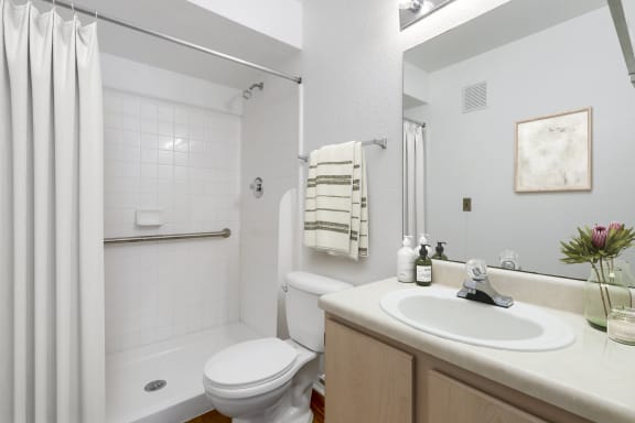 a bathroom with a toilet sink and bathtub