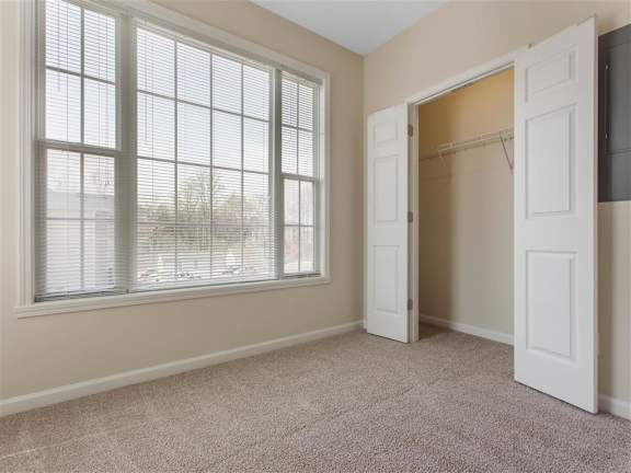 Carpeted Bedroom with En-Suite Bathroom and Closet