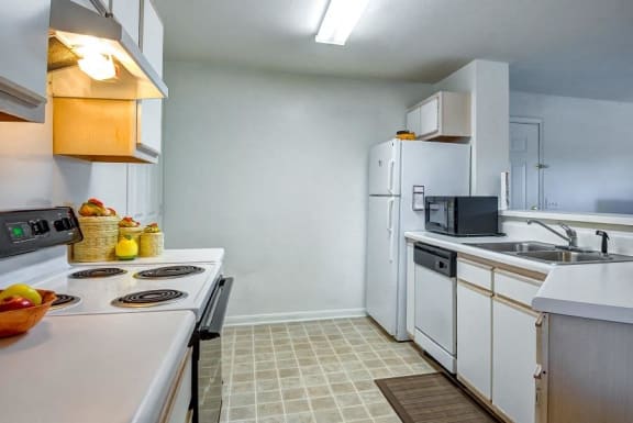 Model Kitchen with White Counters Cabinets and Appliances