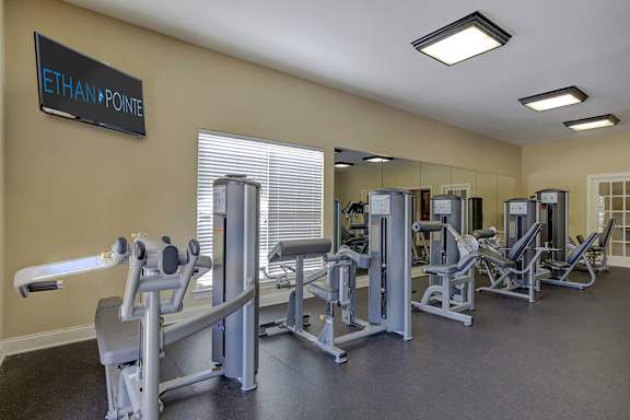 A gym with a variety of equipment including a rowing machine. at Ethan Pointe Apartments, Greensboro, NC, 27215