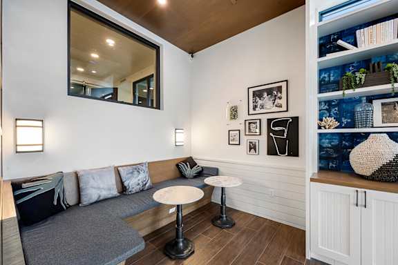 a living room with a couch and two tables