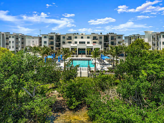 an aerial view of the pool at the resort at longboat key club