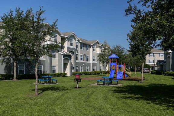 Outdoor Playground equipped with a slide, monkey bars, and latter