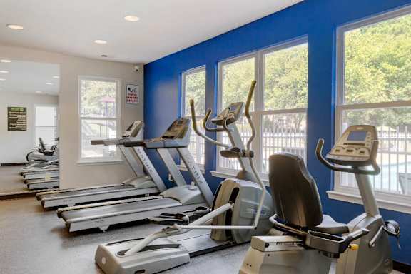 Fitness Center with Exercise Equipment in Front of WIndow at Regency Park Apartment Homes, Raleigh