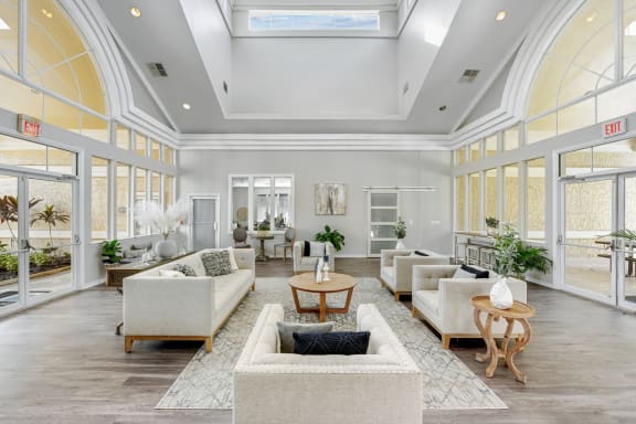 a living room filled with furniture and a large window