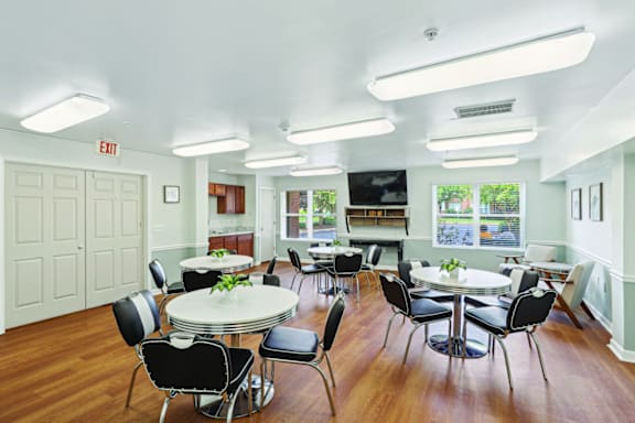A white room with a table and chairs.