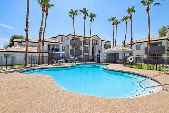 pool with stairs and table at The Village at Sun Valley Apartments, Arizona, 85207
