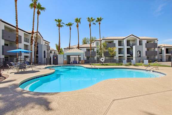 pool with apartment view at The Village at Sun Valley Apartments, Arizona