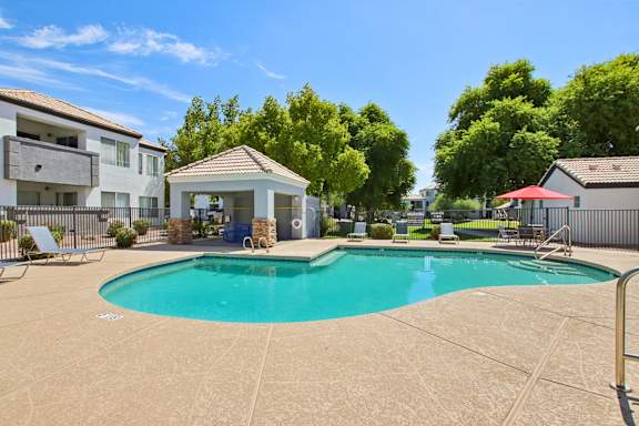 Large Pool with star shap  at The Village at Sun Valley Apartments, Mesa, AZ