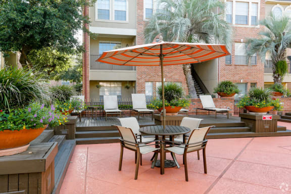 outdoor table and chairs with umbrella covering
