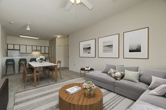 a living room with a couch and a table with chairs