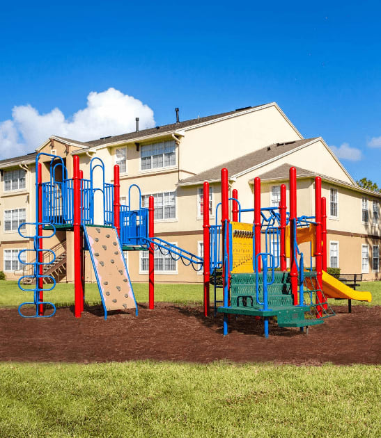 Outdoor Playground equipped with a slide, monkey bars, and latter