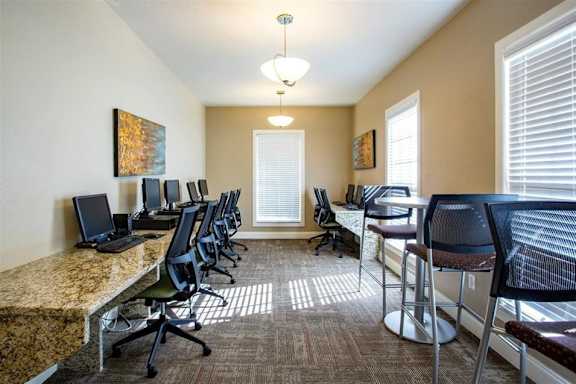 A row of chairs are lined up in a room.