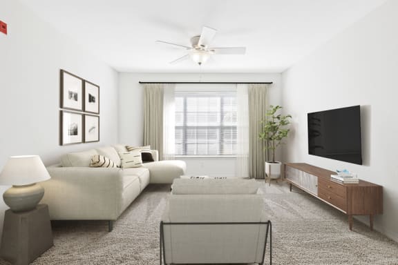 a living room with white walls and a large window