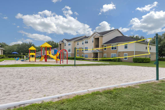 our apartments showcase a sandy volleyball court
