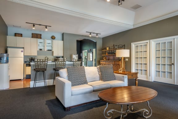a living room filled with furniture and a large window