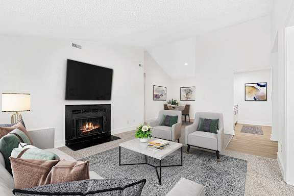Living Room With Tv And Fireplace at Woodlyn on the Green Apartment Homes, Cary, NC, 27513