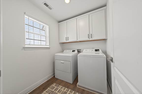 A laundry room with a washer and dryer.