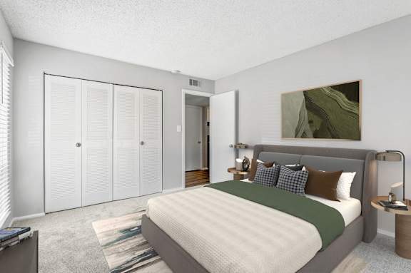 a bedroom with a bed and a closet at Lakes Edge Apartments, Apartments, Greensboro, NC