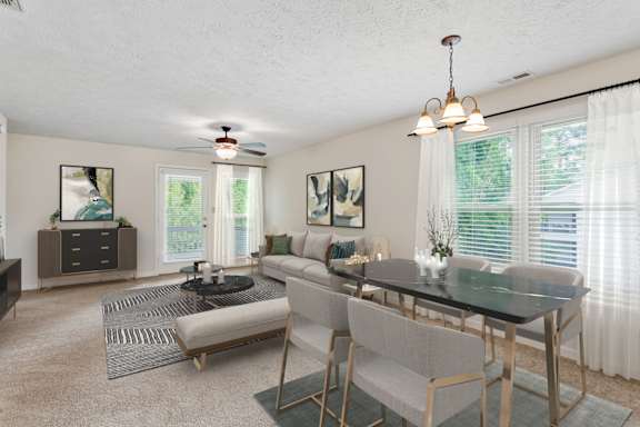 A dining room with a black table and chairs at Hunter's Ridge Apartments, Fayetteville, North Carolina