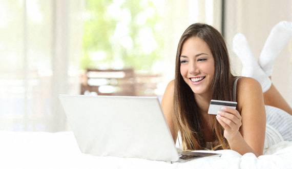 Woman Doing Online Shopping at The Villagio Apartments, Fayetteville, NC