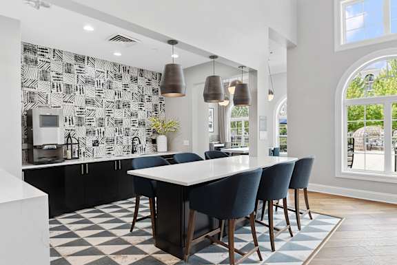 A modern kitchen with a black and white checkered floor.