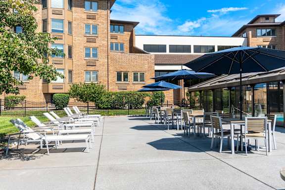 A sunny day at the outdoor seating area of a building.