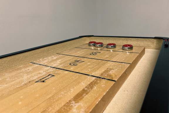 A shuffleboard court with the numbers 1 and 2 on it.