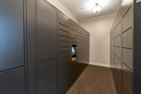 A long hallway with a row of lockers on the left and right.