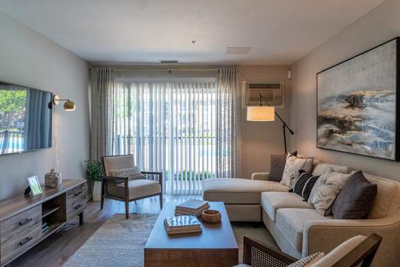 A living room with a couch, chair, and coffee table.