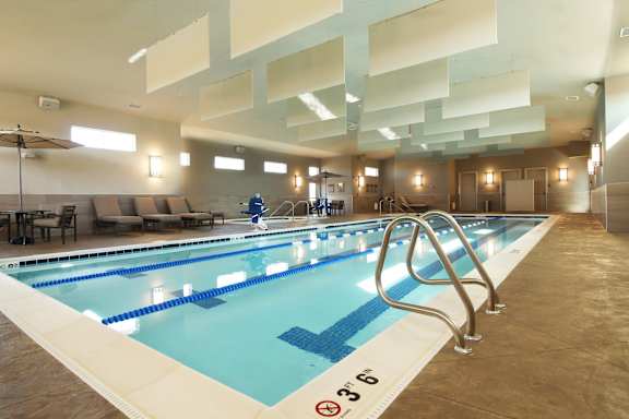 Swimming pool with a no smoking sign.