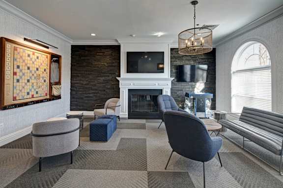 A living room with a fireplace and a television.