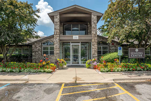 The front of a building with a sign that says "Leasing Center".