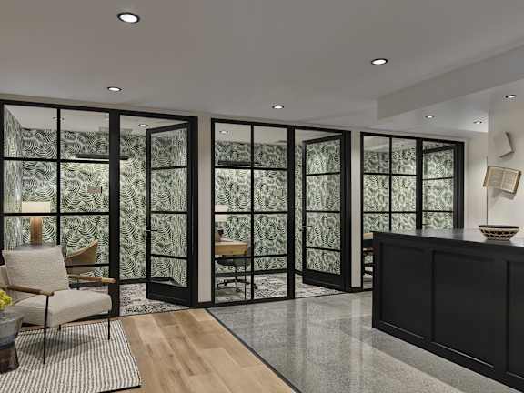 A room with a glass door and a wooden floor.