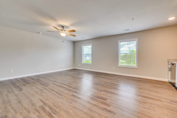 Studio apartment with wood-like flooring and ceiling fan at MacArthur Park, Augusta