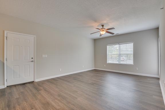 Living room area with ceiling fan at The Vista Apartments &amp; Townhomes, Warrenville