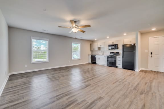 Studio with wood-like flooring, ceiling fan and two windows at MacArthur Park, Augusta