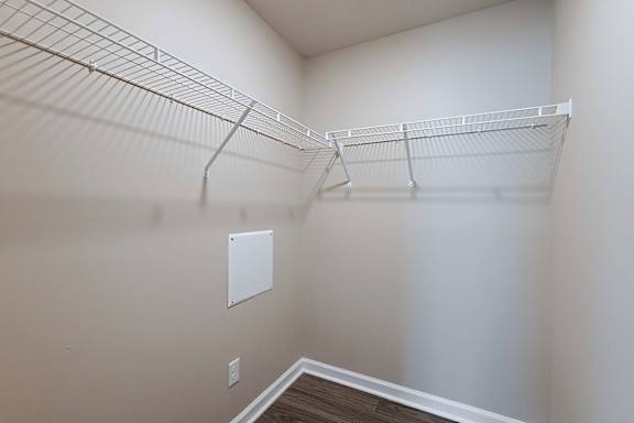 Cozy modern closet with white shelves  at The Vista Apartments &amp; Townhomes, Warrenville South Carolina