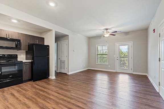 Rustic cozy room with wooden floor at The Vista Apartments &amp; Townhomes, Warrenville, SC