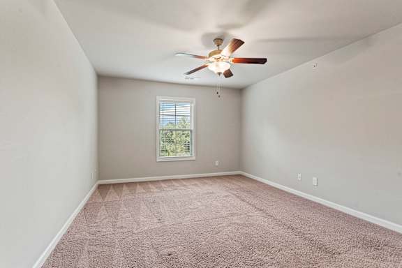 Golden color carpet in a room at The Vista Apartments &amp; Townhomes, Warrenville