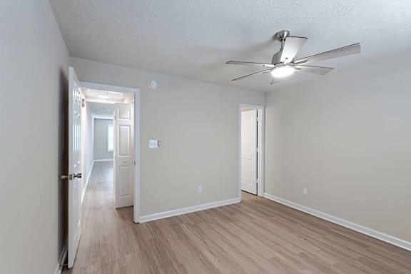 Well-designed elegant room with ceiling fan at Sanctuary Apartments and Townhomes, Augusta, 30909