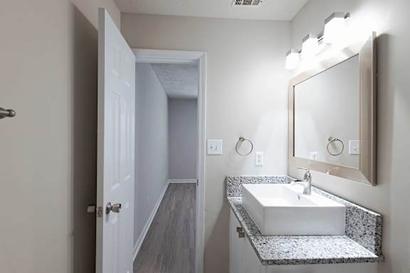 Attractive modern bathroom with mirror setup at Sanctuary Apartments and Townhomes, Augusta