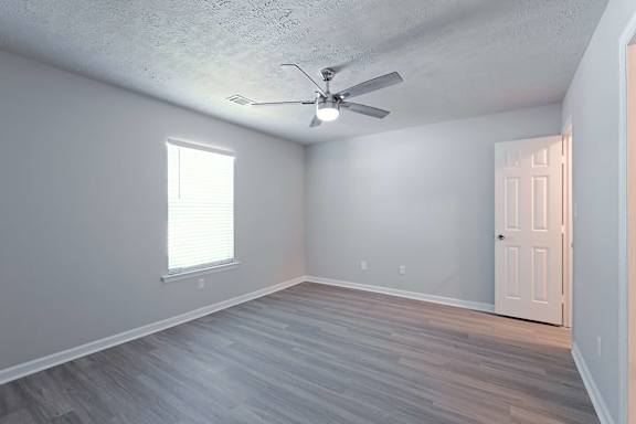 Room with brown patterned flooring at Sanctuary Apartments and Townhomes, Augusta