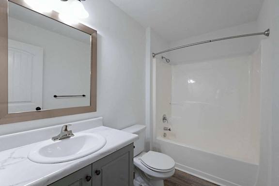 a bathroom with a sink toilet and a shower at Sterlington Apartments, Grovetown, GA
