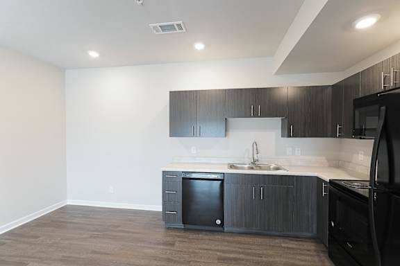 Kitchen with light at The Vista Apartments &amp; Townhomes, Warrenville