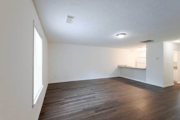 Minimal White Room with Warm Wooden Flooring at Sanctuary Apartments and Townhomes, Augusta, GA