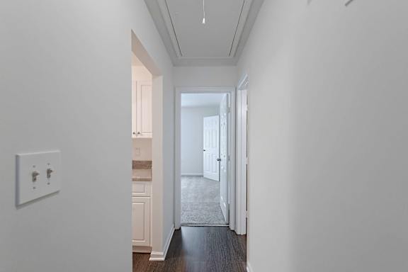 hallway with a light switch on the wall at Sanctuary Apartments and Townhomes, Augusta, 30909